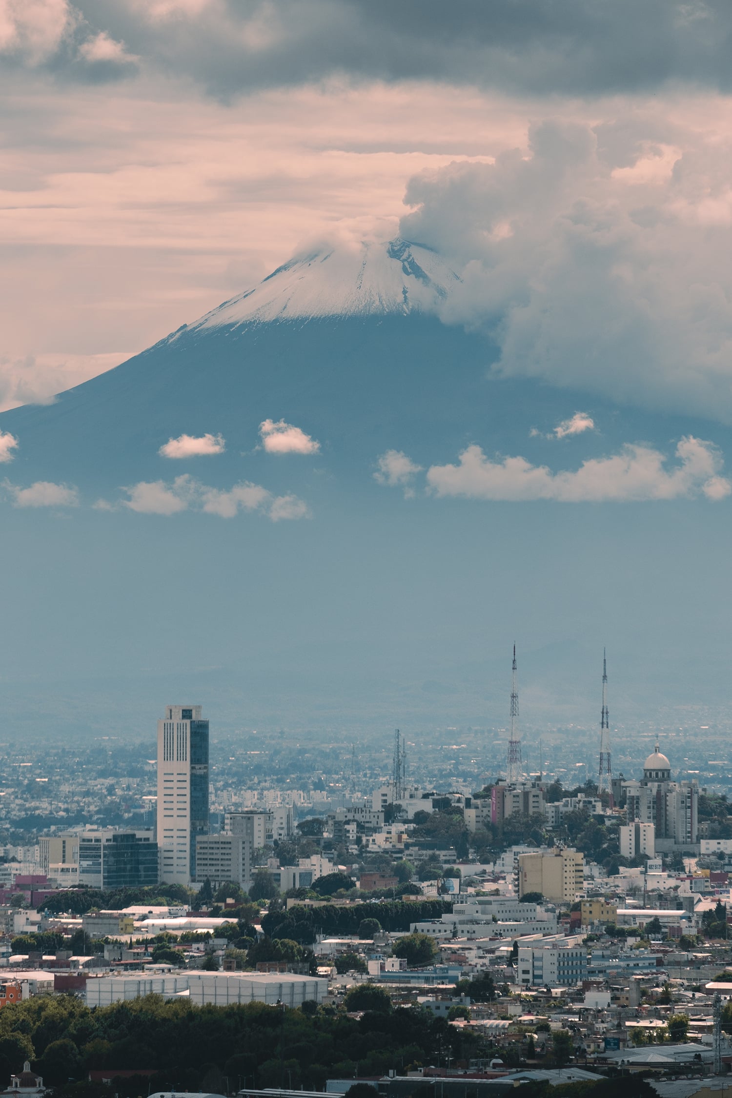 City Beneath the Giant: Popocatépetl Over Puebla